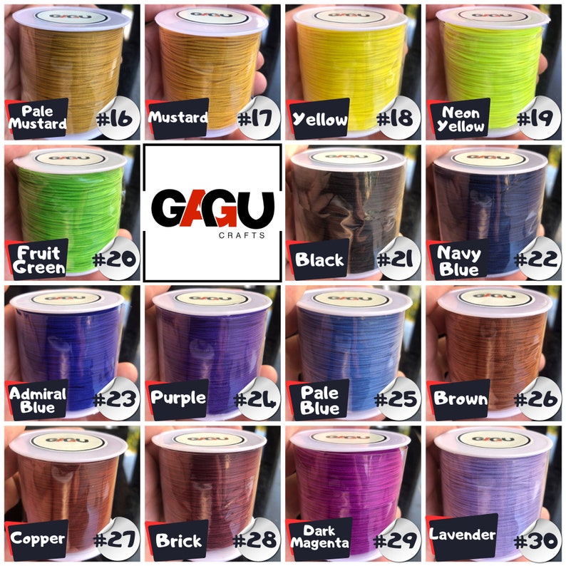 May include: A collection of 15 spools of waxed cord in various colors, including pale mustard, mustard, yellow, neon yellow, fruit green, black, navy blue, admiral blue, purple, pale blue, brown, copper, brick, dark magenta, and lavender. Each spool is labeled with a number from 16 to 30.