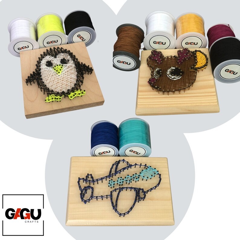 May include: Three string art kits featuring a penguin, a reindeer, and an airplane. Each kit includes a wooden board with pre-installed nails, string, and instructions. The kits are perfect for crafting and decorating.