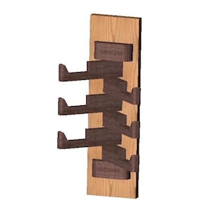 May include: A wooden wall-mounted rack with four brown metal hooks. The rack is made of light wood with a natural finish.