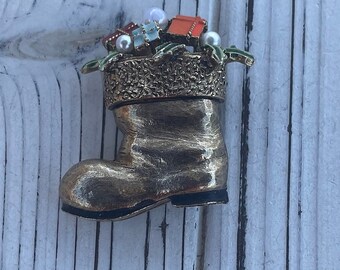 Vintage Santa's Boot filled with colorful gift brooch.