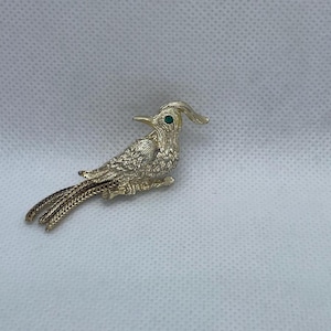Vintage Gold tone Bird with Green Gemstone Eye brooch.