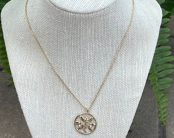 Vintage Avon Gold Tone necklace with round pendant with flower design