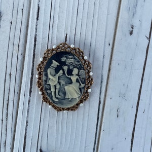 Vintage cameo with couple enjoying time and landscape.