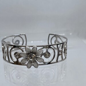 Vintage Wide silver tone flower cuff with clear crystals.