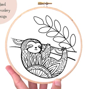 May include: Black and white line art embroidery design of a sloth hanging from a branch with leaves. The sloth is drawn in a detailed, intricate style.