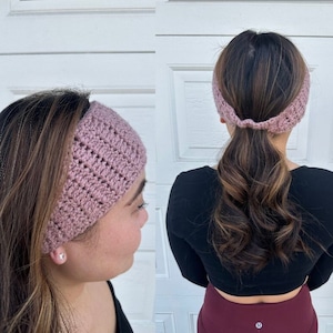 May include: A pink crocheted headband with a simple stitch pattern. The headband is worn by a person with long brown hair, pulled back into a ponytail.
