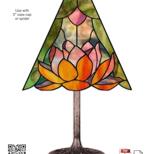May include: A stained glass pendant lamp with a lotus flower design. The lamp has a bronze-colored base and a shade featuring orange, yellow, pink, and green glass. The text "Lotus Lamp 8" Pendant" is visible.