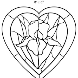 May include: A black and white line drawing of a stained glass pattern in the shape of a heart. The pattern features an iris flower with leaves. The title "Version 2" and the dimensions "8" x 8" are written above the image.