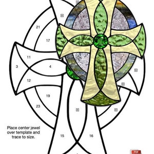 May include: A black and white line drawing of a Celtic cross stained glass pattern. The pattern is labelled with numbers 1 through 23. The cross is 7 1/2 inches by 9 3/4 inches. The text "Place centre jewel over template and trace to size." is included in the image. The text "Down East Stained Glass" is also included in the image.