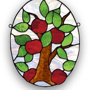 May include: A stained glass window depicting a stylized tree with red apples and green leaves. The tree is set against a white background with a brown trunk and branches.