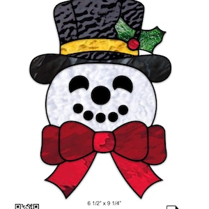 May include: A stained glass pattern titled Dapper Snowman featuring a white snowman head with black eyes, nose, and mouth, wearing a black top hat with a yellow band, green holly, and a red bow tie. Dimensions are 6 1/2 inches by 9 1/4 inches.