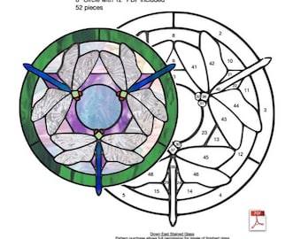 May include: A stained glass pattern for a dragonfly design. The pattern is for an 8-inch circle and includes a 12-inch PDF. The pattern is labeled "Dragonfly Triad 2" and includes 52 pieces.