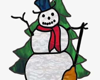May include: A cartoon snowman with a black top hat, red scarf, and a broom. The snowman is standing in front of a green Christmas tree.