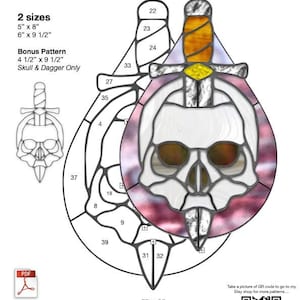 May include: A stained glass pattern titled "Skull & Dagger Teardrop" with two size options: 5" x 8" and 6" x 9 1/2". The design features a skull pierced by a dagger within a teardrop shape. Includes a bonus pattern.