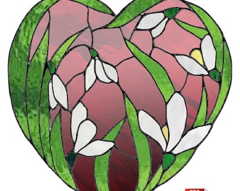 May include: A stained glass pattern of a heart shape with white snowdrop flowers and green leaves. The pattern is available in two sizes: 8 inches by 7 3/4 inches and 16 inches by 15 1/2 inches.