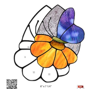 May include: A stained glass pattern of a teardrop-shaped daisy with a butterfly on top. The daisy is yellow and orange, and the butterfly is purple and blue. The pattern is 6 inches by 7 1/4 inches.
