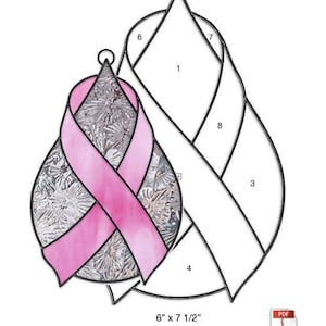 May include: A stained glass pattern for a teardrop-shaped ribbon. The pattern is labeled with numbers 1 through 8. The pattern is 6 inches by 7 1/2 inches.
