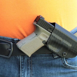 REVKEL Custom Kydex Belt Lock Loop Cross Draw Holster  compatible with the Cz pistols. Hand Crafted with pride in Texas, USA.