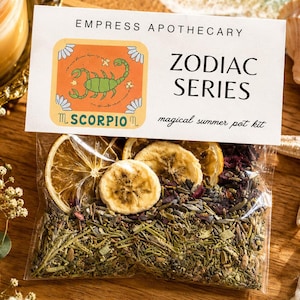 May include: A clear plastic pouch containing dried herbs, flower petals, and slices of dried citrus and banana. The label reads EMPRESS APOTHECARY ZODIAC SERIES SCORPIO magical summer pot kit, featuring a green scorpion illustration on an orange square.