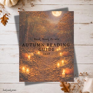 May include: A rectangular print titled Book Nook Prints AUTUMN READING GUIDE 2026 featuring a forest path covered in orange autumn leaves, illuminated by glowing candles and pumpkins under a full moon, with a warm, golden, and brown color palette.