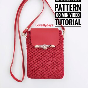 May include: A red crocheted crossbody bag with a matching red leather flap and strap. The bag features a silver clasp and the text "ENGLISH PDF PATTERN 60 MIN VIDEO TUTORIAL". The bag is designed with a textured stitch.