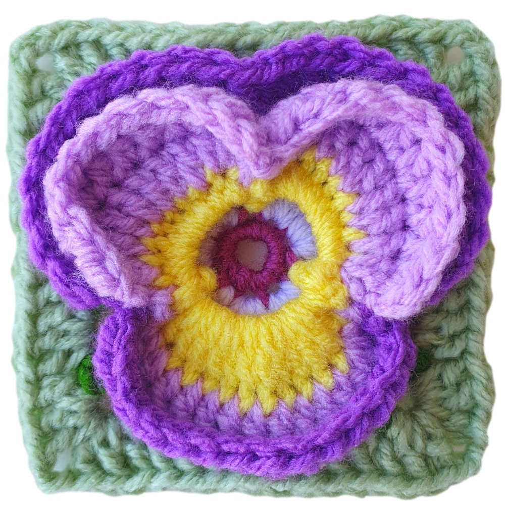 38 Pansy Crochet Patterns for Flowers, Decor, and Wearable Details 11 Pansy Flower Granny Square Crochet Pattern: 3D Floral