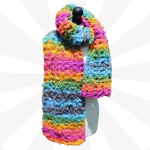 May include: A colorful crocheted scarf with a rainbow pattern in shades of pink, orange, yellow, green, blue, and purple. The scarf is made with a chunky yarn and has a loose, open weave.