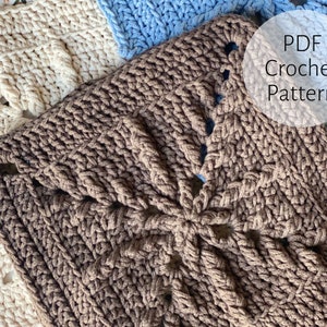 May include: A close-up of a brown crochet square with a unique pattern. The square is surrounded by other crochet squares in white and blue. The text "PDF Crochet Pattern" is visible in the image.