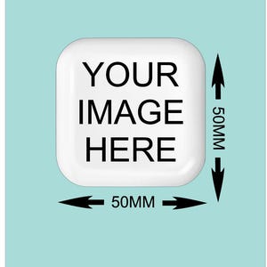 May include: A white, square product with rounded corners, displaying the text "YOUR IMAGE HERE" in black. The dimensions are marked as 50mm x 50mm, with black arrows indicating the measurements. The background is a light teal colour.