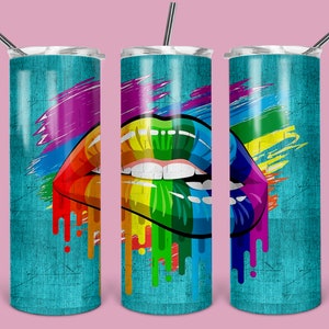 May include: Three stainless steel tumblers with a rainbow-colored lips design. The tumblers have a turquoise blue background with a distressed texture. Each tumbler has a straw.