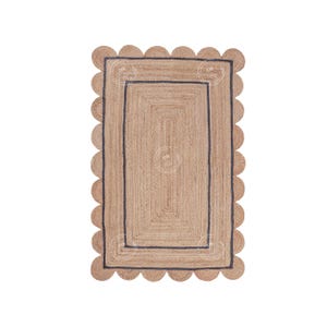May include: A natural fiber rug with a scalloped edge and a black border. The rug has a woven texture and a rectangular shape.