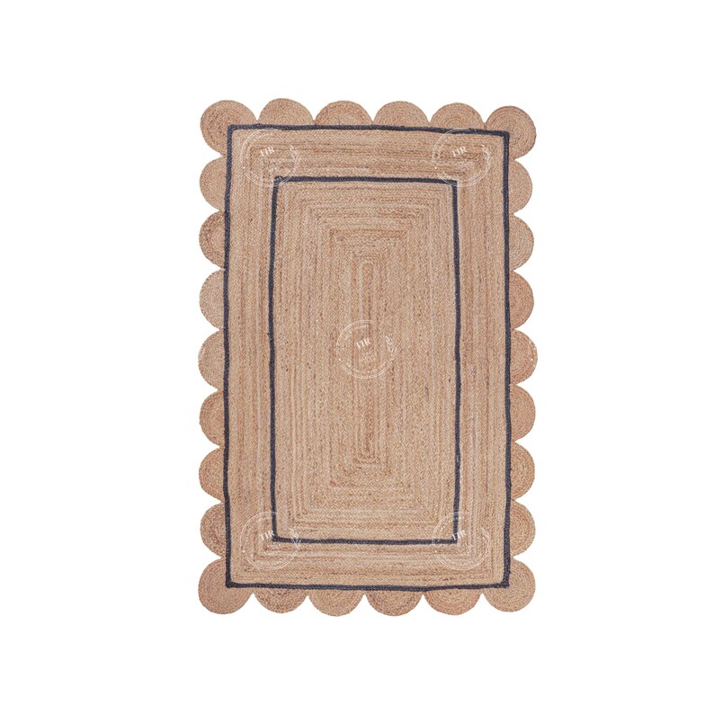 May include: A natural fiber rug with a scalloped edge and a black border. The rug has a woven texture and a rectangular shape.