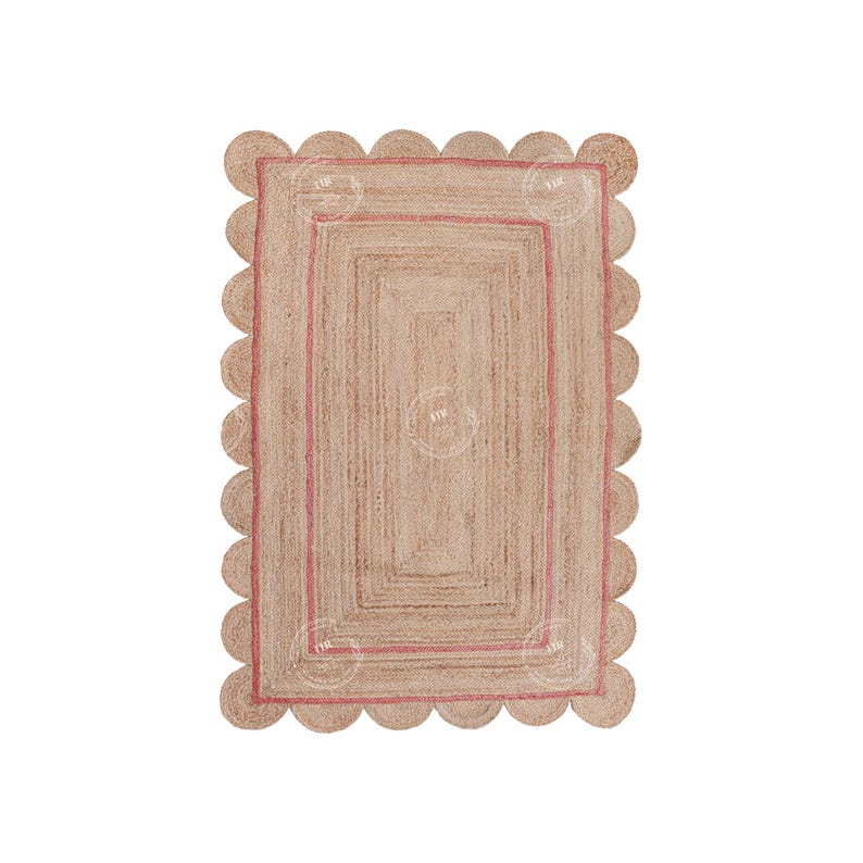 May include: A natural fiber rug with a pink border and scalloped edges. The rug has a woven texture and a rectangular shape.