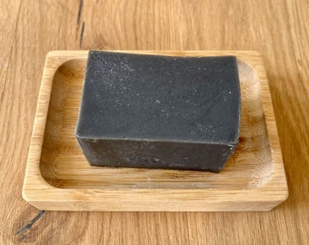 Seife mit Tonerde schwarz, pflegende Seife, soap nourishing, verpackt in Papiertüte, sabun