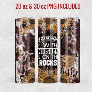 May include: A 20 oz and 30 oz tumbler design featuring a rustic wood background with a leopard print and cowhide pattern. The design also includes sunflowers and the text "My Relationship With Whiskey Is On The Rocks".