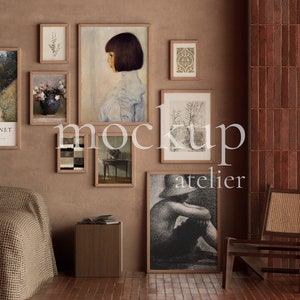 May include: A collection of framed artwork in various styles and sizes, including a landscape painting, a portrait, and abstract art. The artwork is displayed on a brown wall with a wooden chair and a blanket on a bed in the foreground.