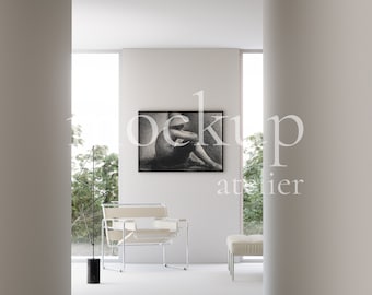 May include: A white chair with a chrome frame sits in a minimalist room with a black and white photograph hanging on the wall. The room has a white floor and white walls.