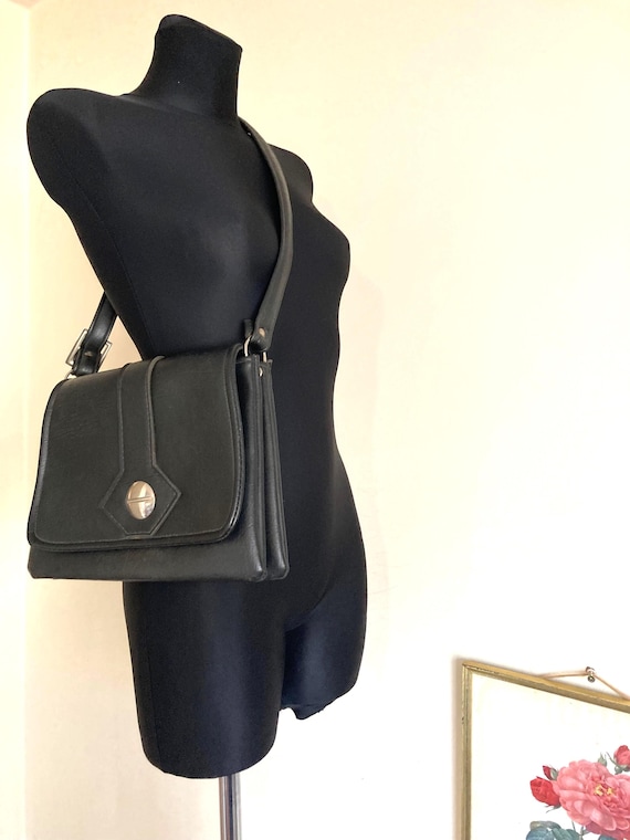 Vintage 60s-70s Black Shoulder Bag | Faux Leather | Adjustable Strap w/Clasp Closure w/Round Metal Detail | Wider at Bottom 3 Compartments