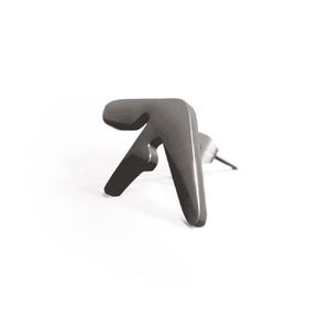 May include: A single, dark gray earring in the shape of a stylized symbol. The earring has a post for insertion and a smooth, metallic finish. The design is modern and minimalist, set against a white background.