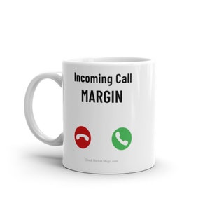 May include: White ceramic mug with a black and white graphic of a phone with the text "Incoming Call MARGIN" and the website "Stock Market Mugs.com".