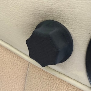 May include: A black plastic hexagonal knob with a textured surface.