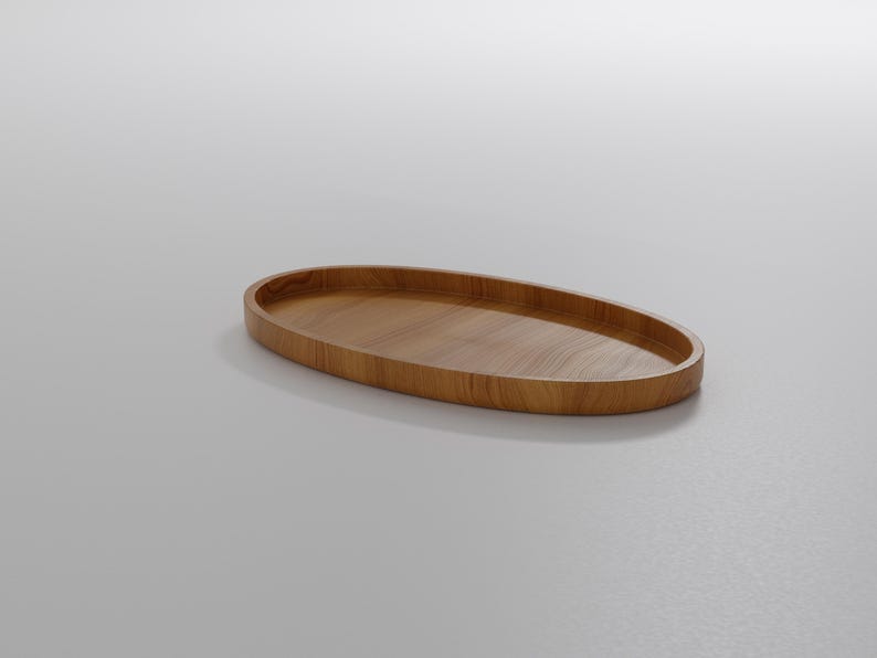 May include: A wooden, oval-shaped tray with a smooth, polished surface. The tray is made of light brown wood and has a slightly raised edge. The design is simple and modern, suitable for serving or display.