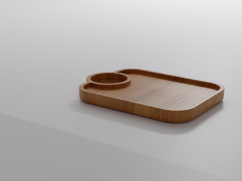 May include: A wooden serving tray with a built-in cup holder. The tray is rectangular with rounded corners and a light brown wood grain finish. The cup holder is a circular indentation. The tray is designed for serving drinks and snacks.