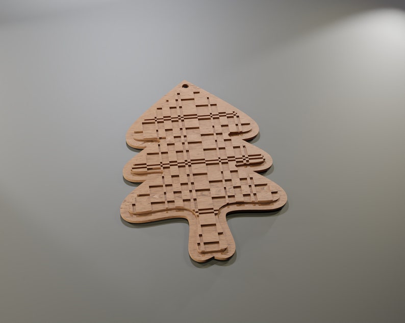 May include: A wooden Christmas tree ornament with a unique, layered design. The tree is light brown with a grid-like pattern cut into the wood. It has a small hole at the top for hanging. The ornament is a festive decoration.