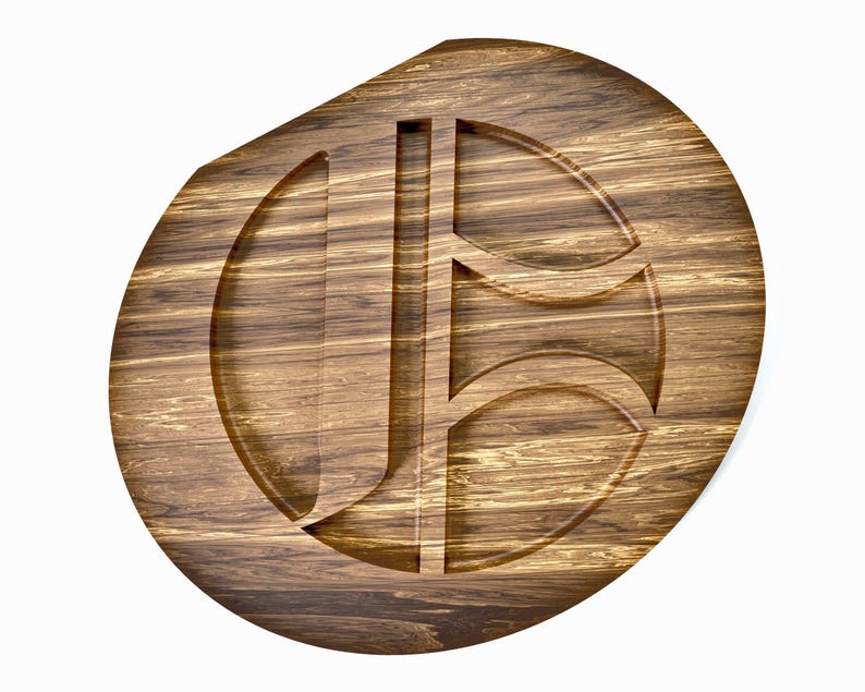 May include: A wooden serving tray with a carved design. The tray is oval-shaped with a dark brown finish and visible wood grain. The carved design features the letters "J" and "B" in a stylized font. The tray is approximately 12 inches in diameter.
