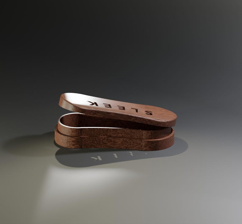 May include: A wooden box with a hinged lid, open to reveal the interior. The box is a rich brown color, with the word "SLEEK" engraved on the lid. The box is designed with a curved shape.