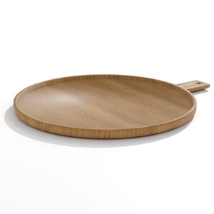 May include: A round, light brown wooden serving tray with a handle. The tray has a raised edge and a smooth, natural wood grain finish. The handle is rectangular with a small hole. Ideal for serving food or as a decorative piece.