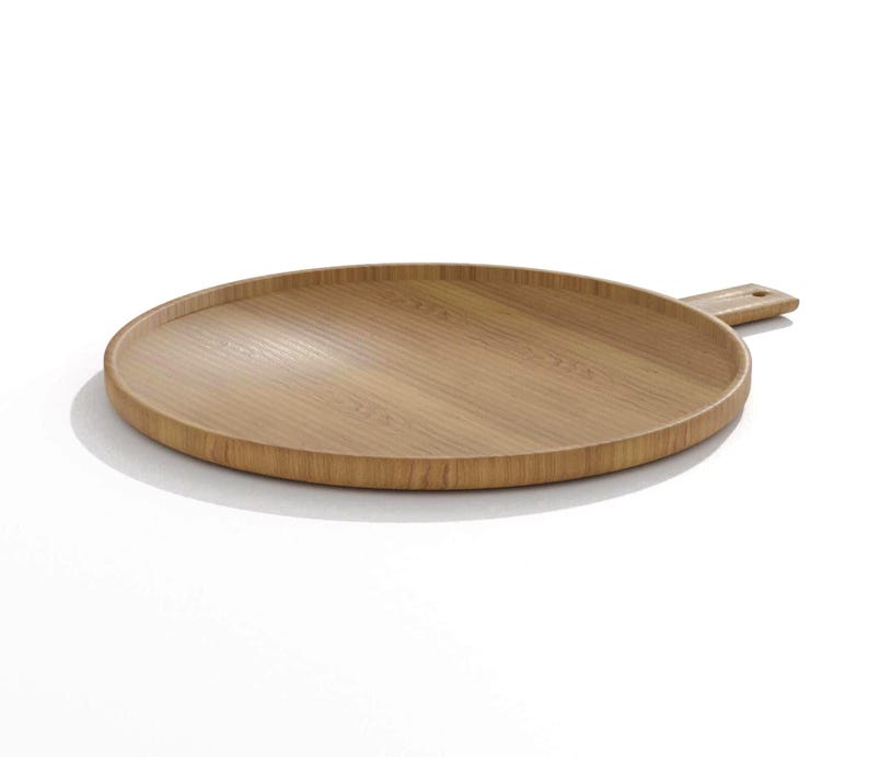 May include: A round, light brown wooden serving tray with a handle. The tray has a raised edge and a smooth, natural wood grain finish. The handle is rectangular with a small hole. Ideal for serving food or as a decorative piece.