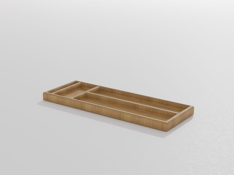 K&ouml;nnte beinhalten: Ein rechteckiges Organizer-Tablett aus Holz mit mehreren F&auml;chern. Das Tablett besteht aus hellbraunem Holz und hat eine glatte Oberfl&auml;che. Die F&auml;cher sind unterschiedlich gro&szlig; und f&uuml;r die Organisation kleiner Gegenst&auml;nde konzipiert.