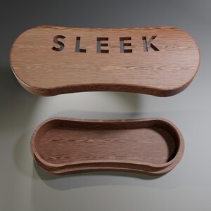 May include: Two-piece wooden storage box with a natural wood grain finish. The top piece has the word "SLEEK" cut out. The bottom piece is a tray with curved edges. The pieces are made of a warm brown wood.